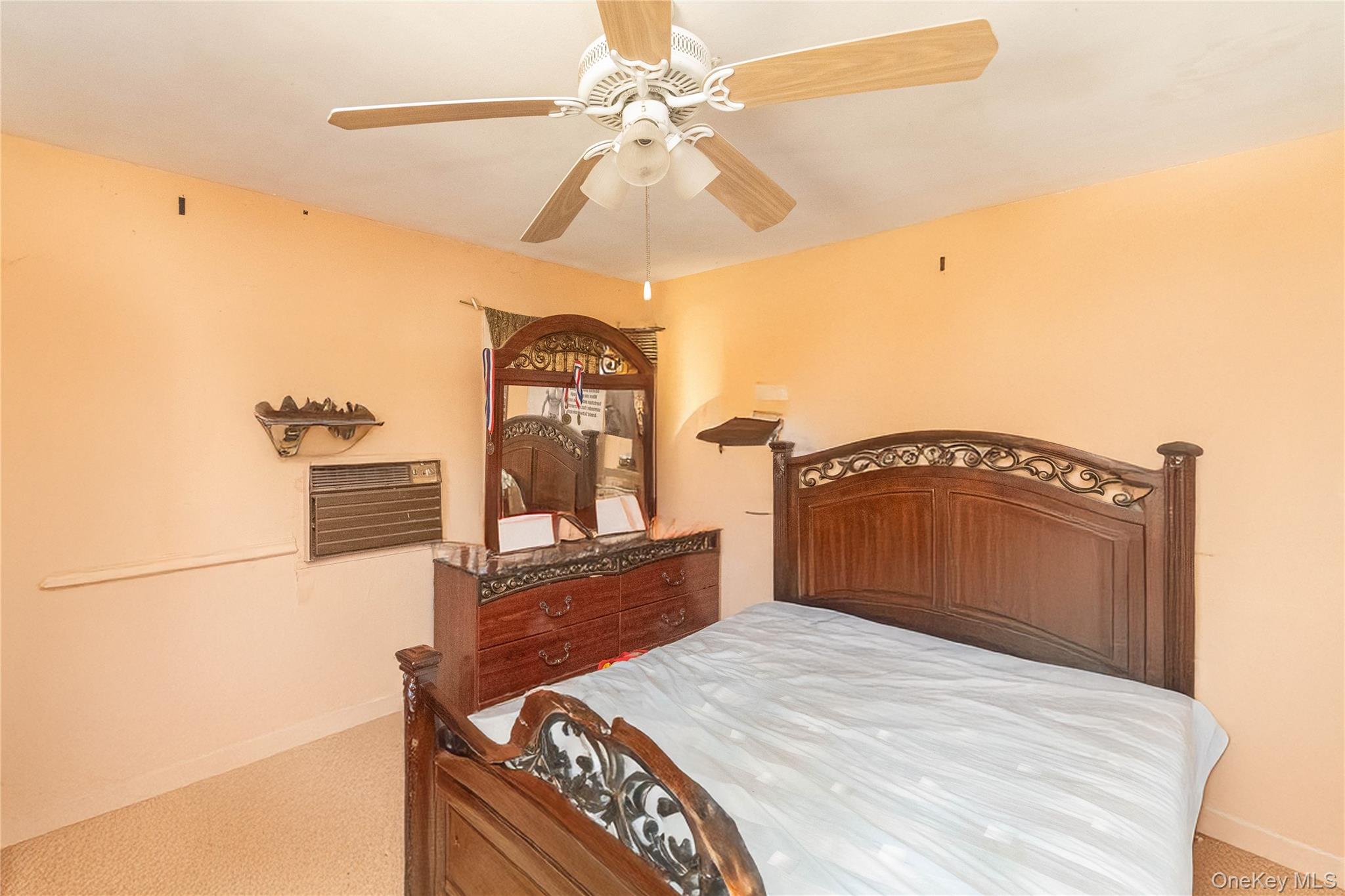 7 Merrick Lane Spring Valley, NY 10977 - Photo 20 of 28 a bedroom with a bed and a dresser