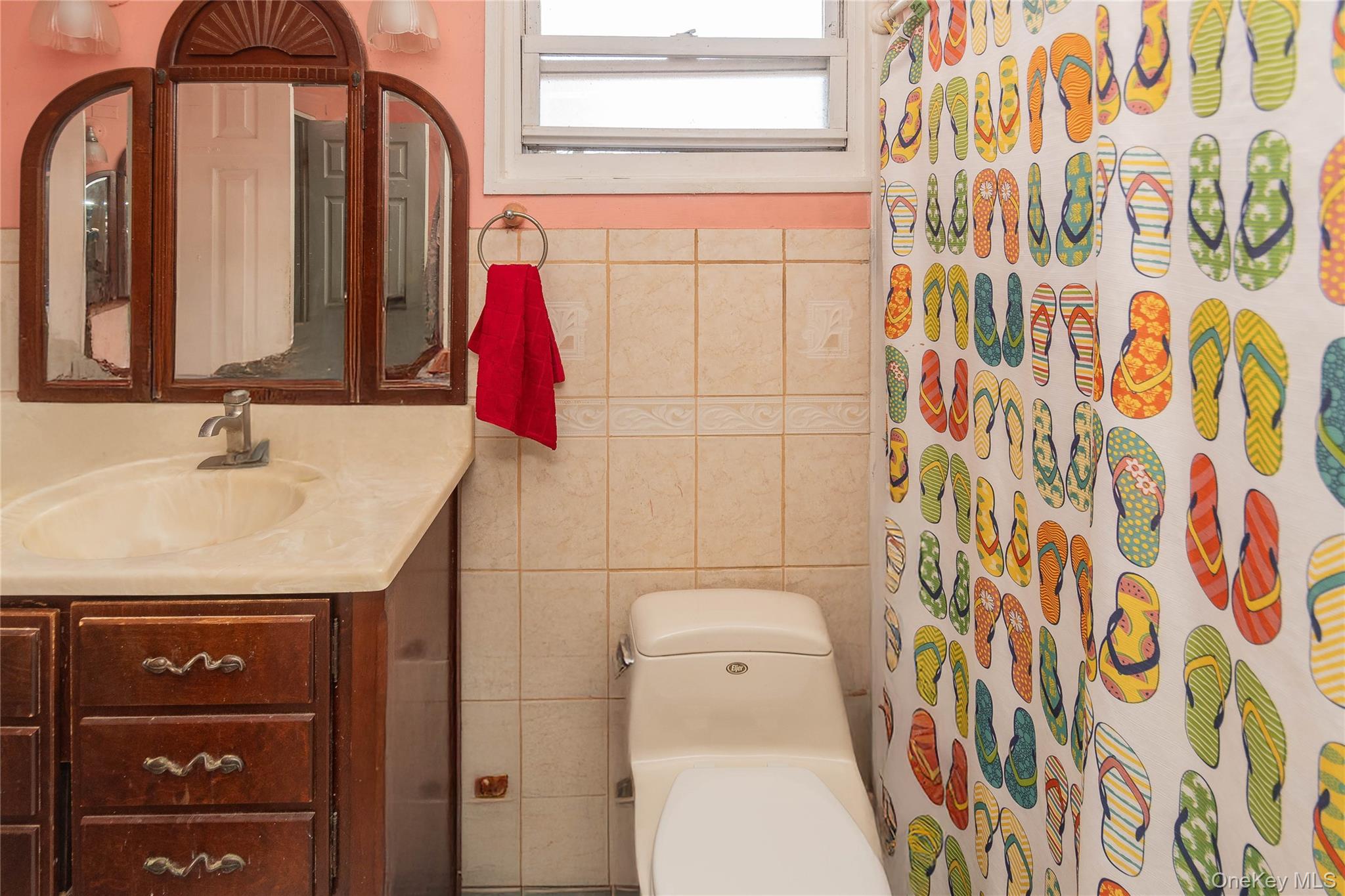 7 Merrick Lane Spring Valley, NY 10977 - Photo 23 of 28 a bathroom with a sink and a mirror