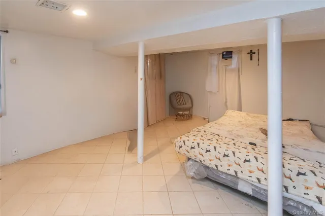 a bedroom with a bed and a table in it