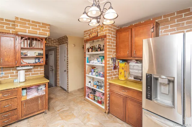 a kitchen with stainless steel appliances a refrigerator and a stove