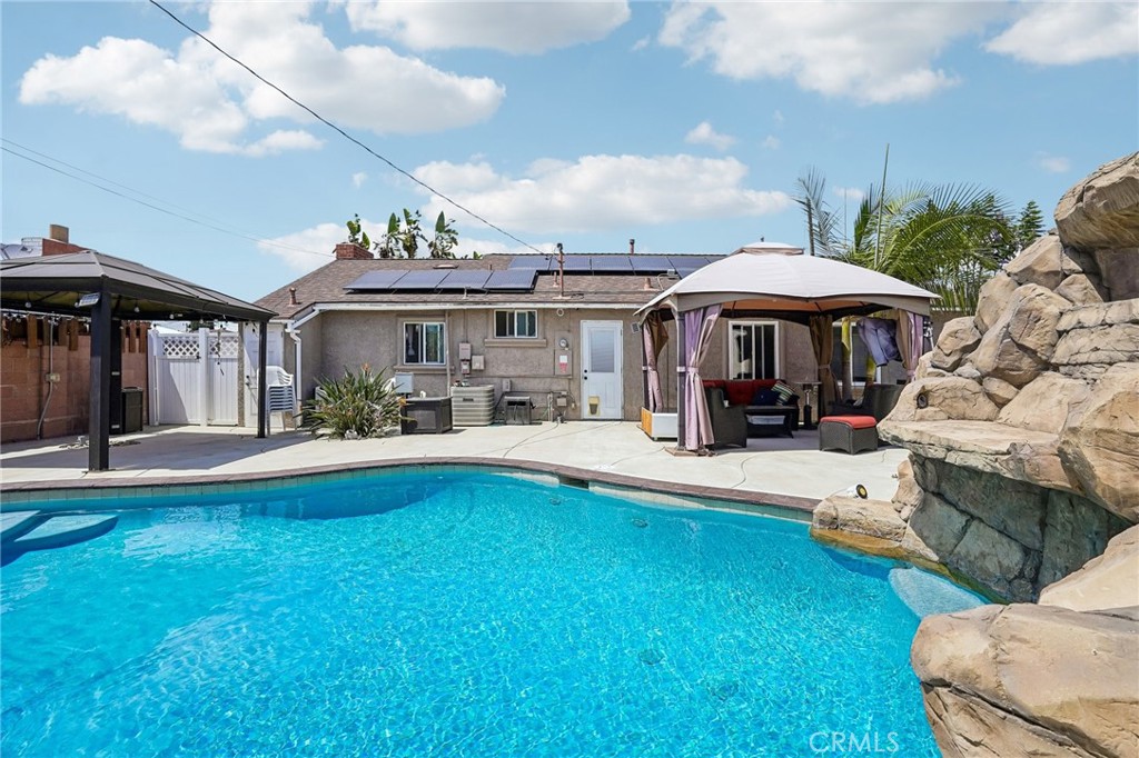 6412 Shawnee Road Westminster, CA 92683 - Photo 27 of 36 a view of a patio with table and chairs under an umbrella