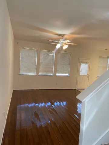 a view of a livingroom with wooden floor