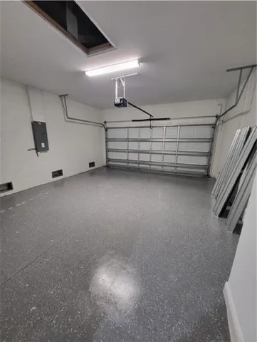 a view of an empty room with stairs and ventilation