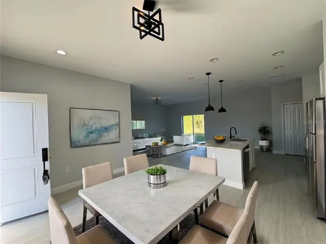 a view of a dining room with furniture