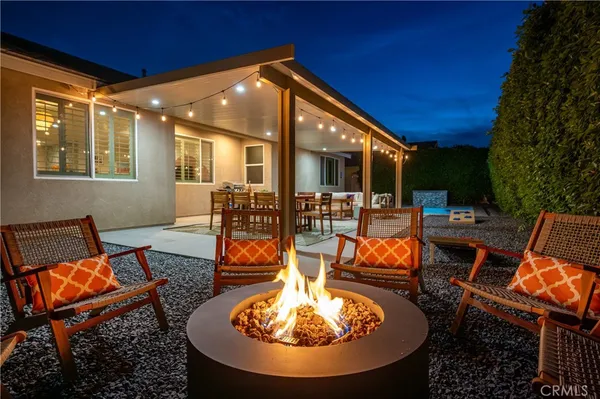 a outdoor space with the couches and dining table