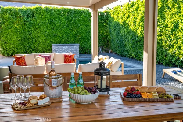 a kitchen with stainless steel appliances granite countertop a refrigerator a stove a microwave a sink and dishwasher