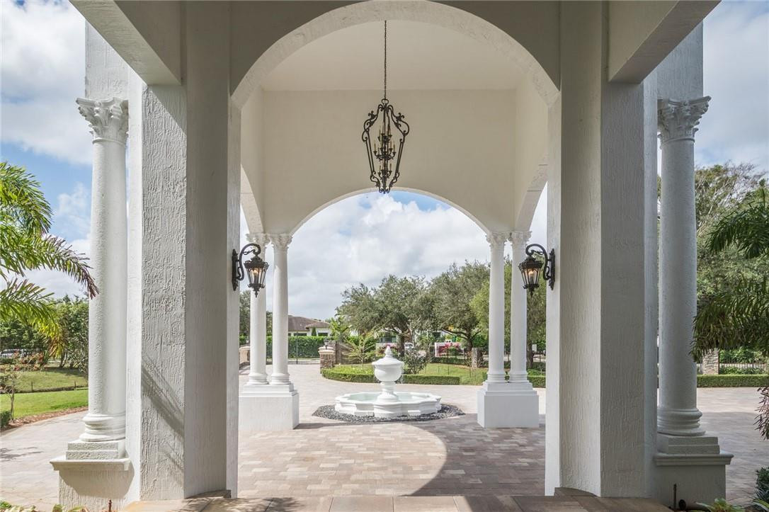 5780 Southwest 128th Avenue Southwest Ranches, FL 33330 - Photo 17 of 80 a view of a porch with a floor to ceiling window and wooden floor