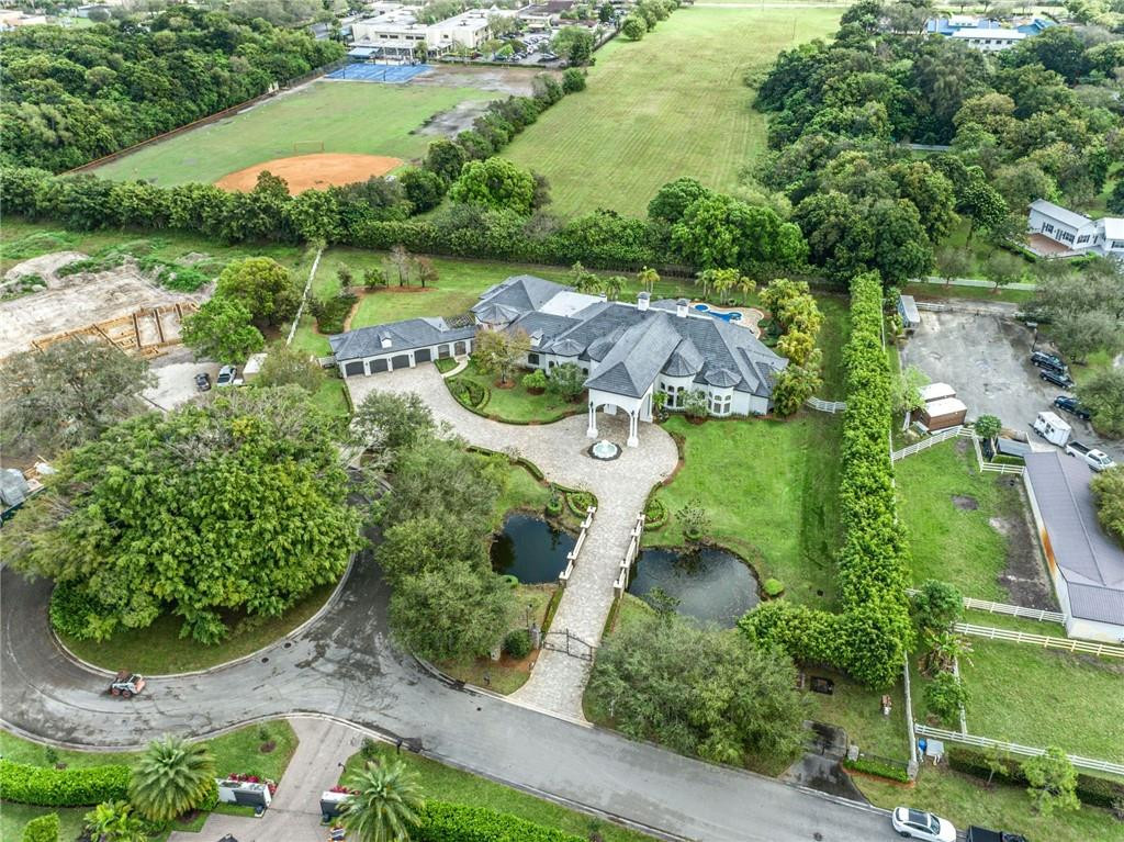 5780 Southwest 128th Avenue Southwest Ranches, FL 33330 - Photo 2 of 80 an aerial view of a house with yard