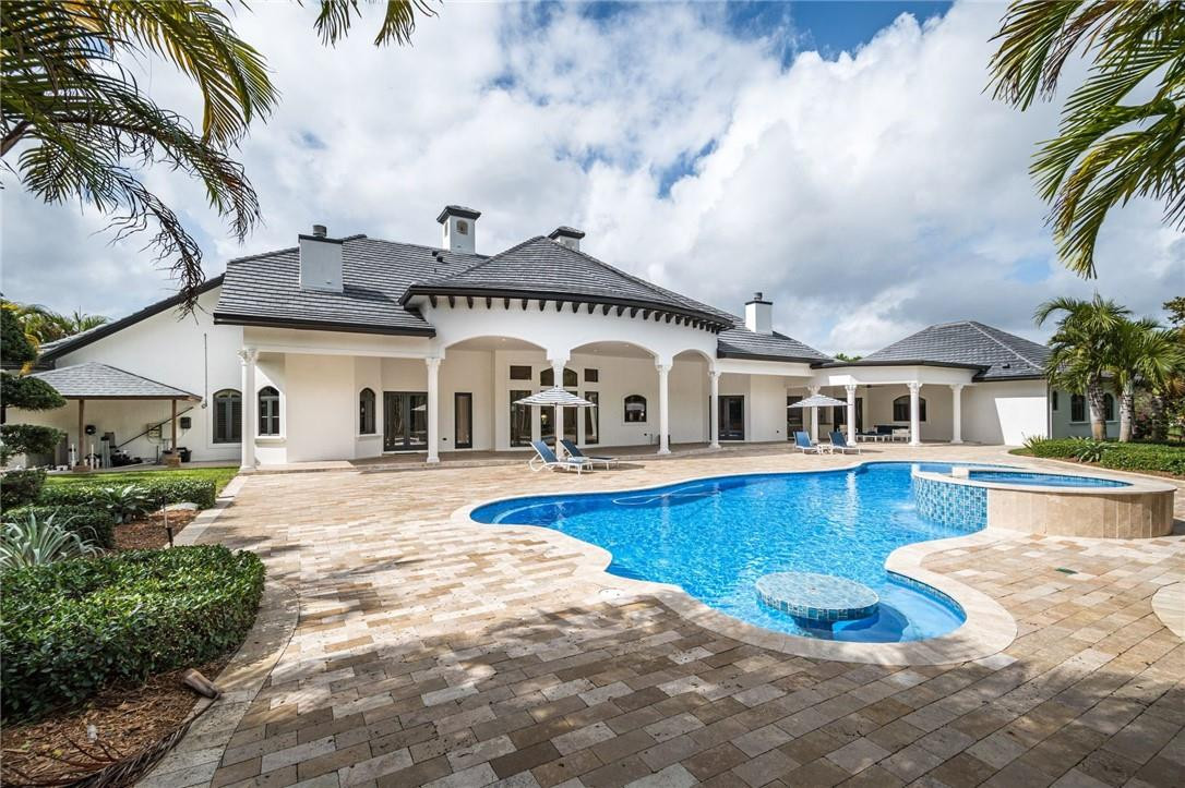 5780 Southwest 128th Avenue Southwest Ranches, FL 33330 - Photo 25 of 80 a front view of a house with swimming pool and sitting area