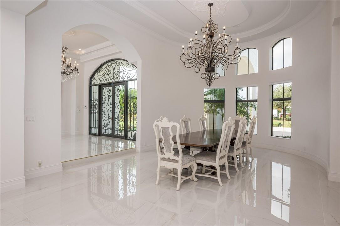 5780 Southwest 128th Avenue Southwest Ranches, FL 33330 - Photo 38 of 80 a view of a dining room with furniture and a chandelier