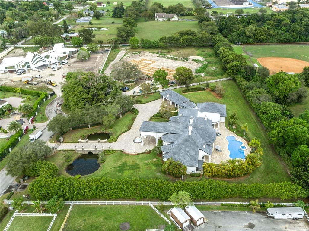 5780 Southwest 128th Avenue Southwest Ranches, FL 33330 - Photo 4 of 80 an aerial view of a house with yard swimming pool and outdoor seating