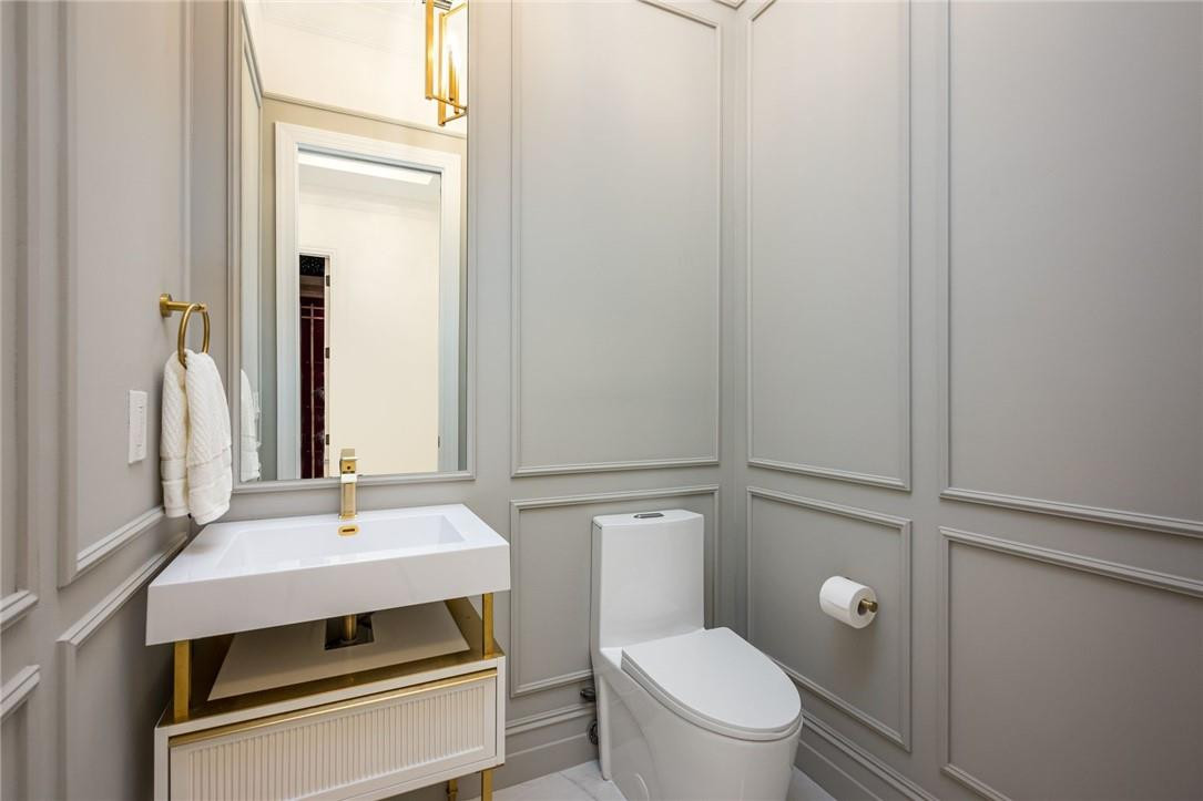 5780 Southwest 128th Avenue Southwest Ranches, FL 33330 - Photo 62 of 80 a bathroom with a sink toilet and mirror