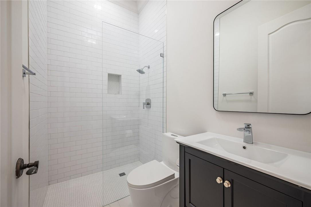5780 Southwest 128th Avenue Southwest Ranches, FL 33330 - Photo 68 of 80 a bathroom with a sink toilet a mirror and shower