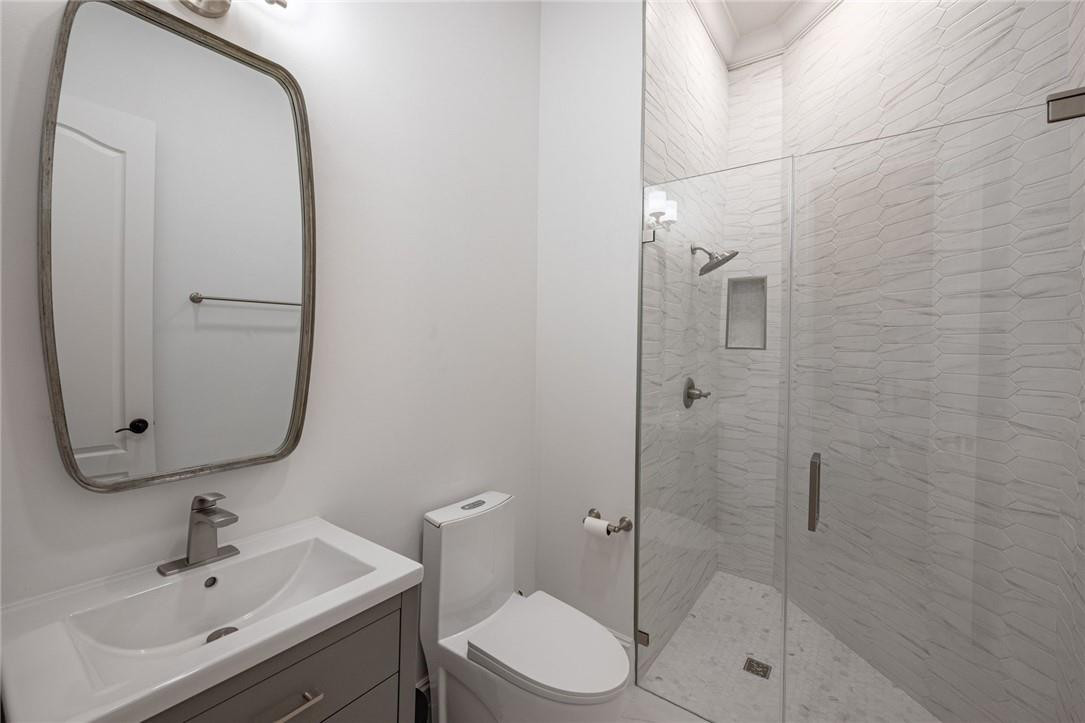 5780 Southwest 128th Avenue Southwest Ranches, FL 33330 - Photo 70 of 80 a bathroom with a toilet sink shower and mirror