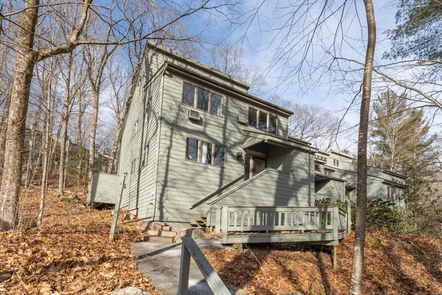 a view of a house with large windows