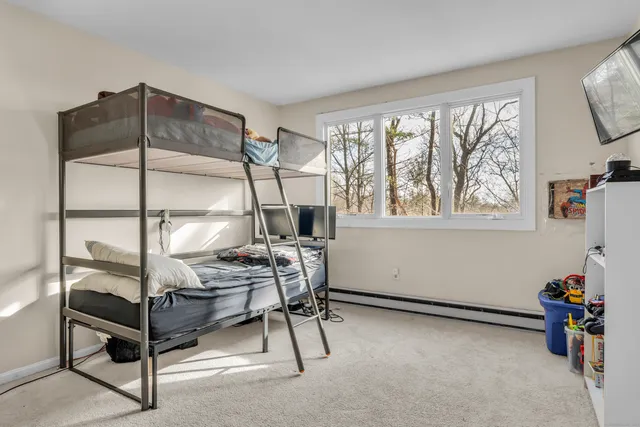 a view of room with window and furniture