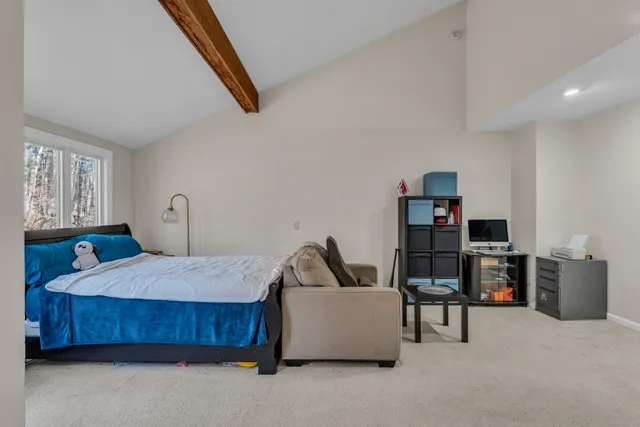 a bedroom with furniture and window