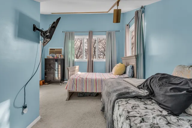 a bedroom with a bed and window