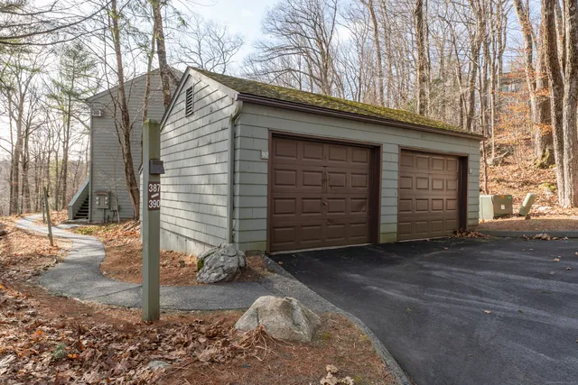 a view of a house with a snow in the yard