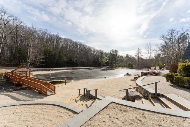 a view of swimming pool with chairs