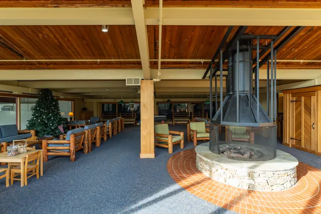 a view of a house with backyard porch and sitting area