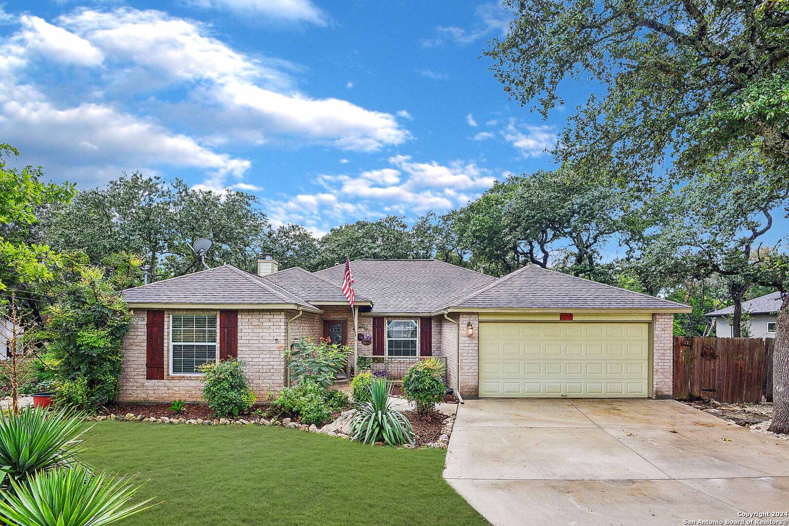 27111 Bumble Bee San Antonio, TX 78260 - Photo 1 of 1 a front view of a house with a garden and plants