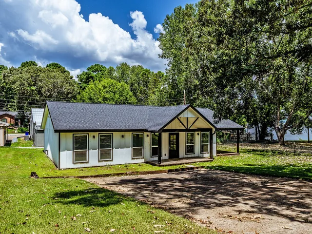 a house with trees in the background