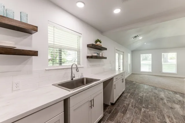 a kitchen with sink and window