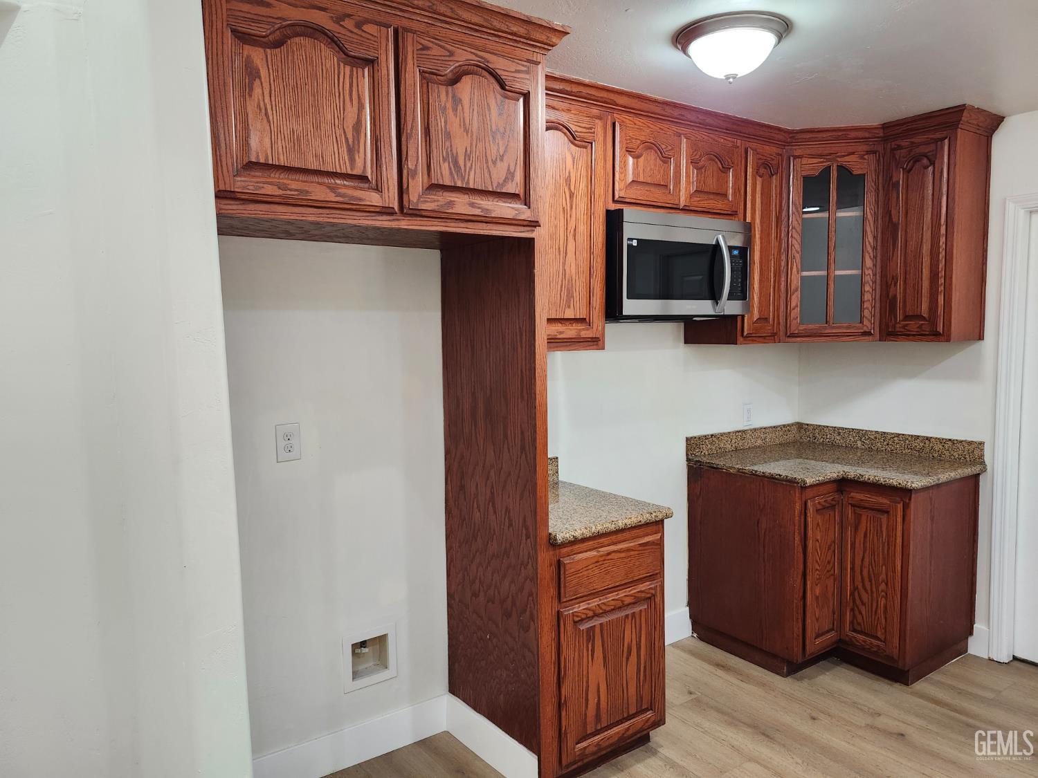 Undisclosed Address Delano, CA 93215 - Photo 14 of 33 a kitchen with stainless steel appliances granite countertop a refrigerator and a stove top oven