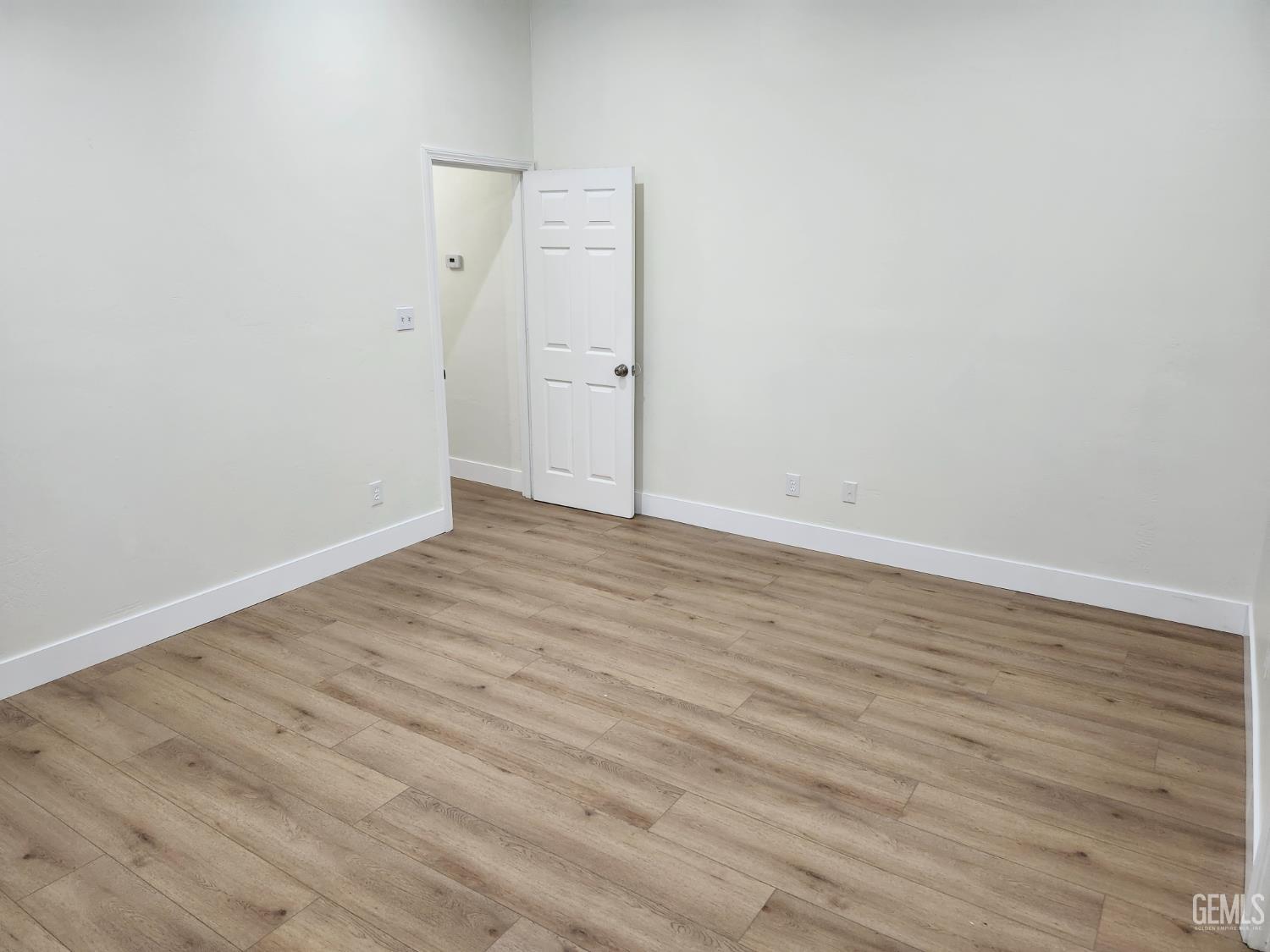 Undisclosed Address Delano, CA 93215 - Photo 18 of 33 wooden floor in a empty room