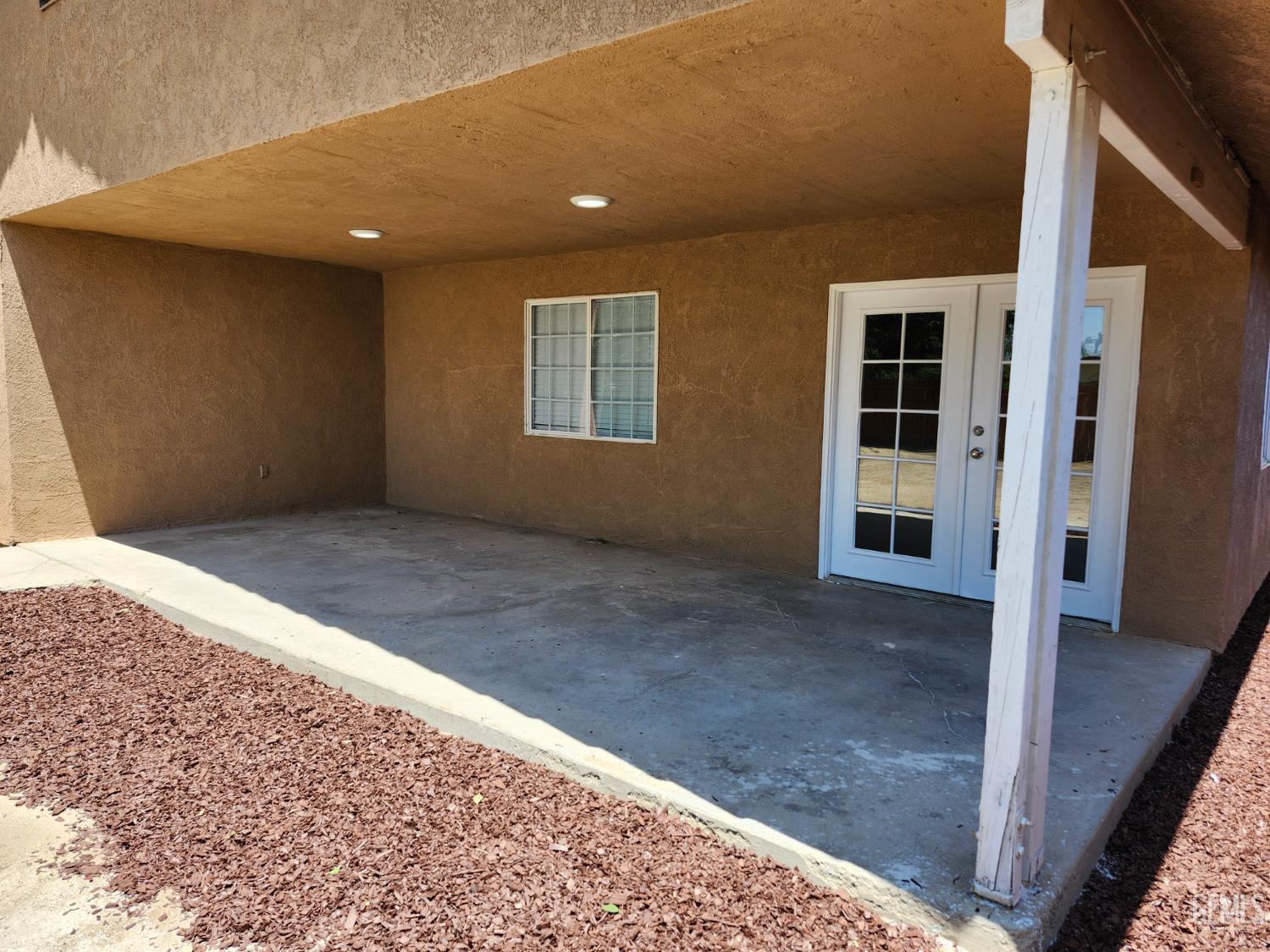 Undisclosed Address Delano, CA 93215 - Photo 30 of 33 a view of an empty room with wooden floor and entryway