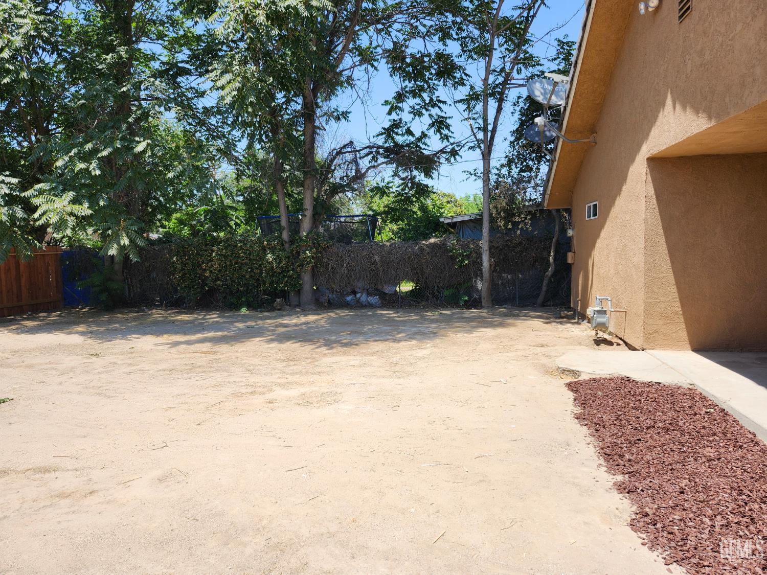 Undisclosed Address Delano, CA 93215 - Photo 32 of 33 a house with trees in front of it