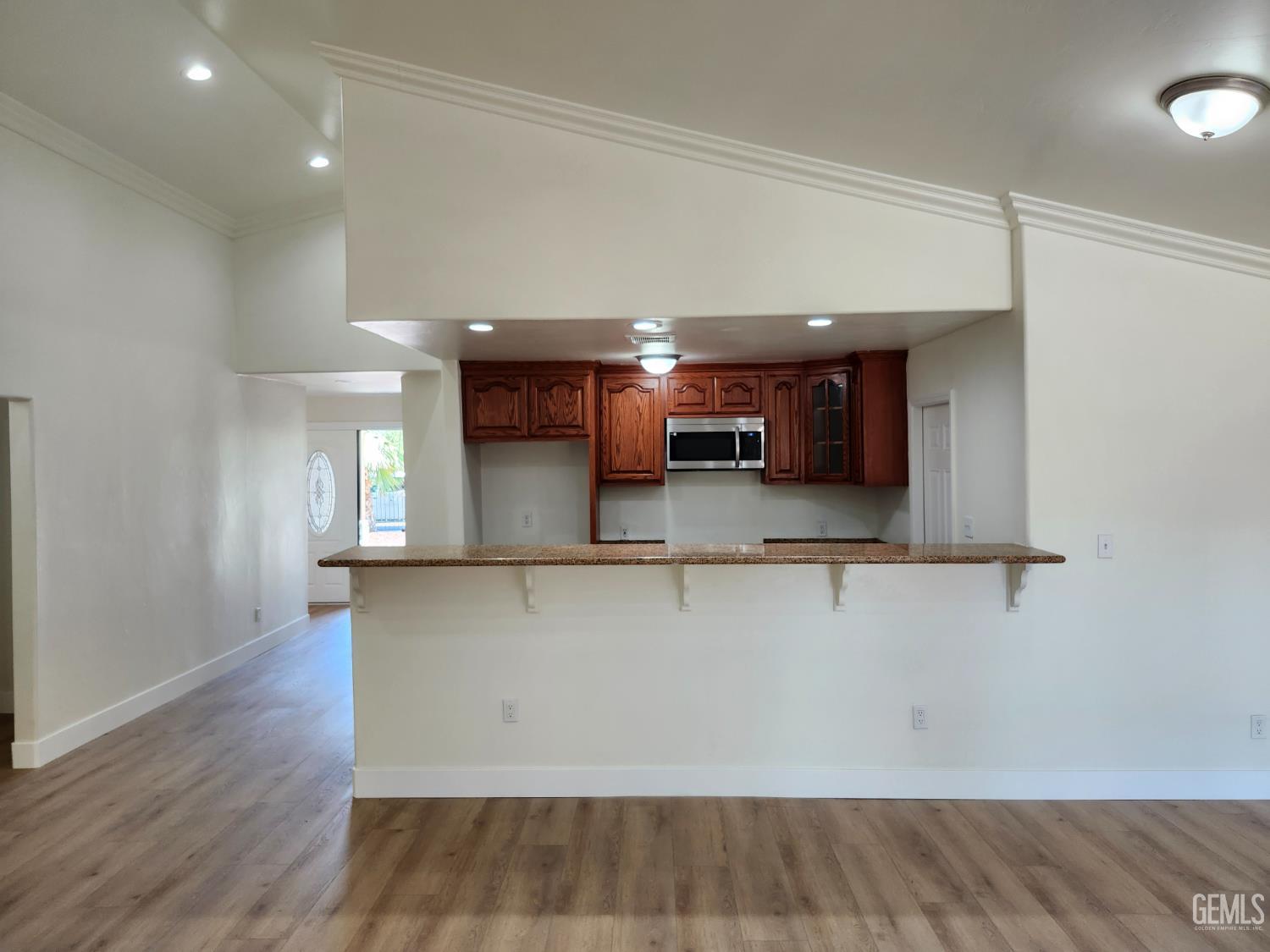 Undisclosed Address Delano, CA 93215 - Photo 10 of 33 a view of a kitchen with stainless steel appliances wooden floor and a window