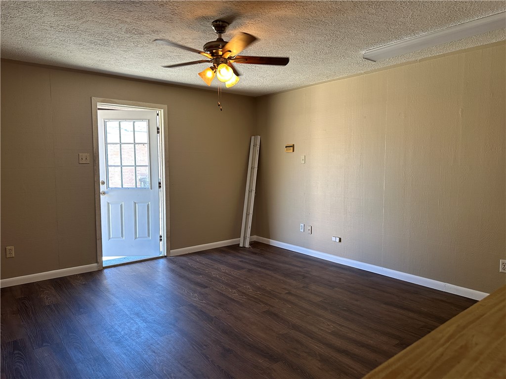 4705 Wooldridge Road Corpus Christi, TX 78413 - Photo 15 of 16 an empty room with wooden floor and window