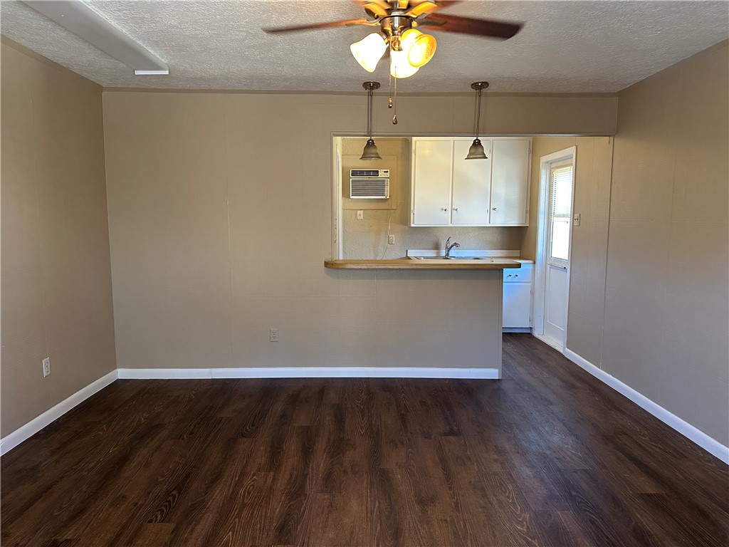 4705 Wooldridge Road Corpus Christi, TX 78413 - Photo 16 of 16 a view of a kitchen with a sink and dishwasher with wooden floor