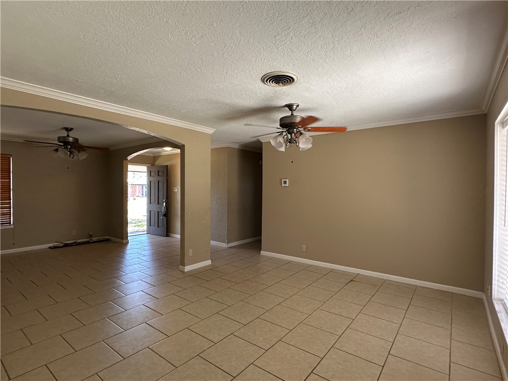 4705 Wooldridge Road Corpus Christi, TX 78413 - Photo 3 of 16 wooden floor in an empty room and a window