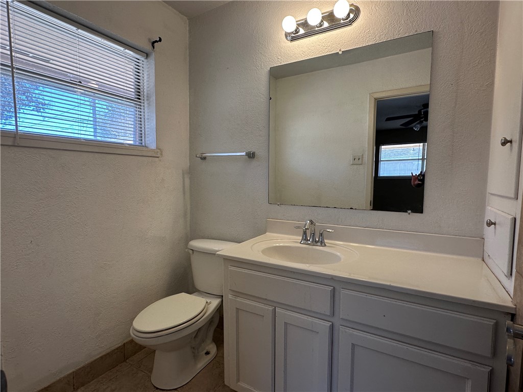 4705 Wooldridge Road Corpus Christi, TX 78413 - Photo 10 of 16 a bathroom with a sink and a toilet