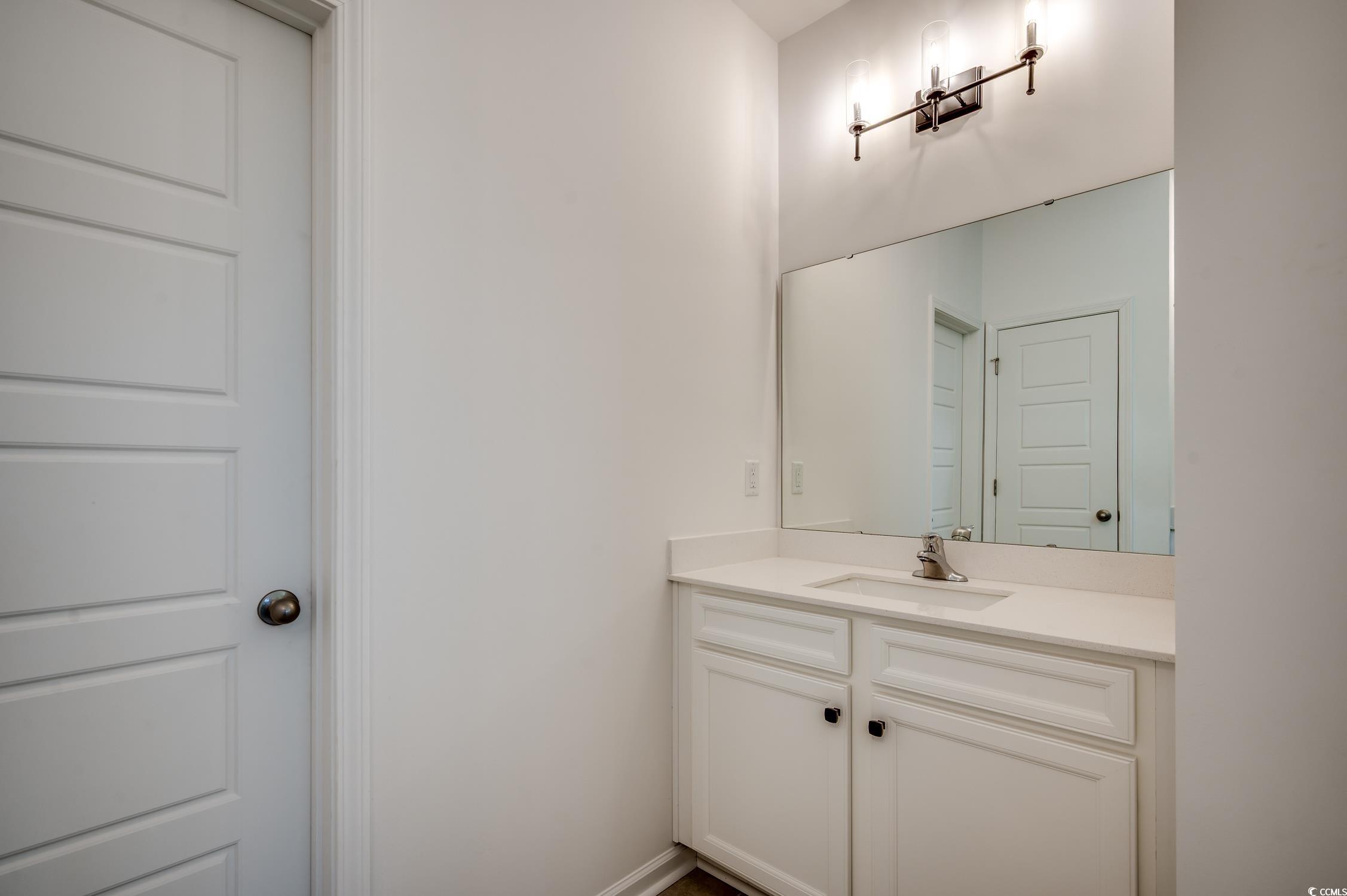 4004 Braid Court Myrtle Beach, SC 29588 - Photo 11 of 24 Bathroom with vanity and baseboards