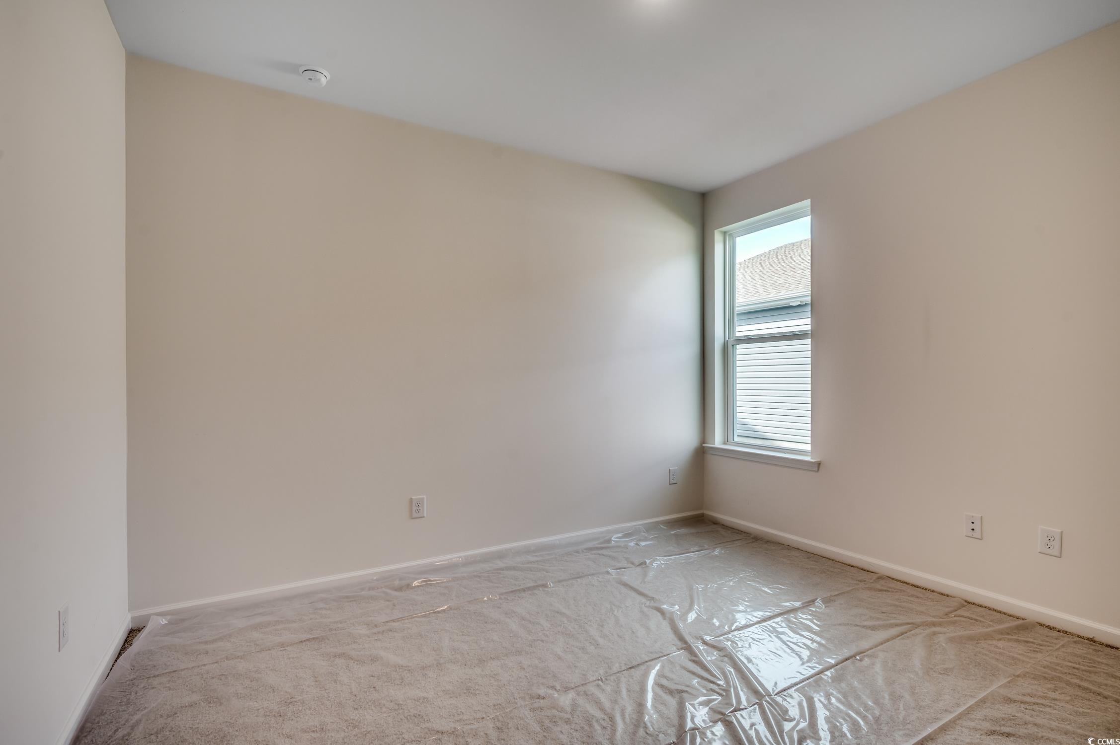 4004 Braid Court Myrtle Beach, SC 29588 - Photo 13 of 24 Empty room featuring baseboards