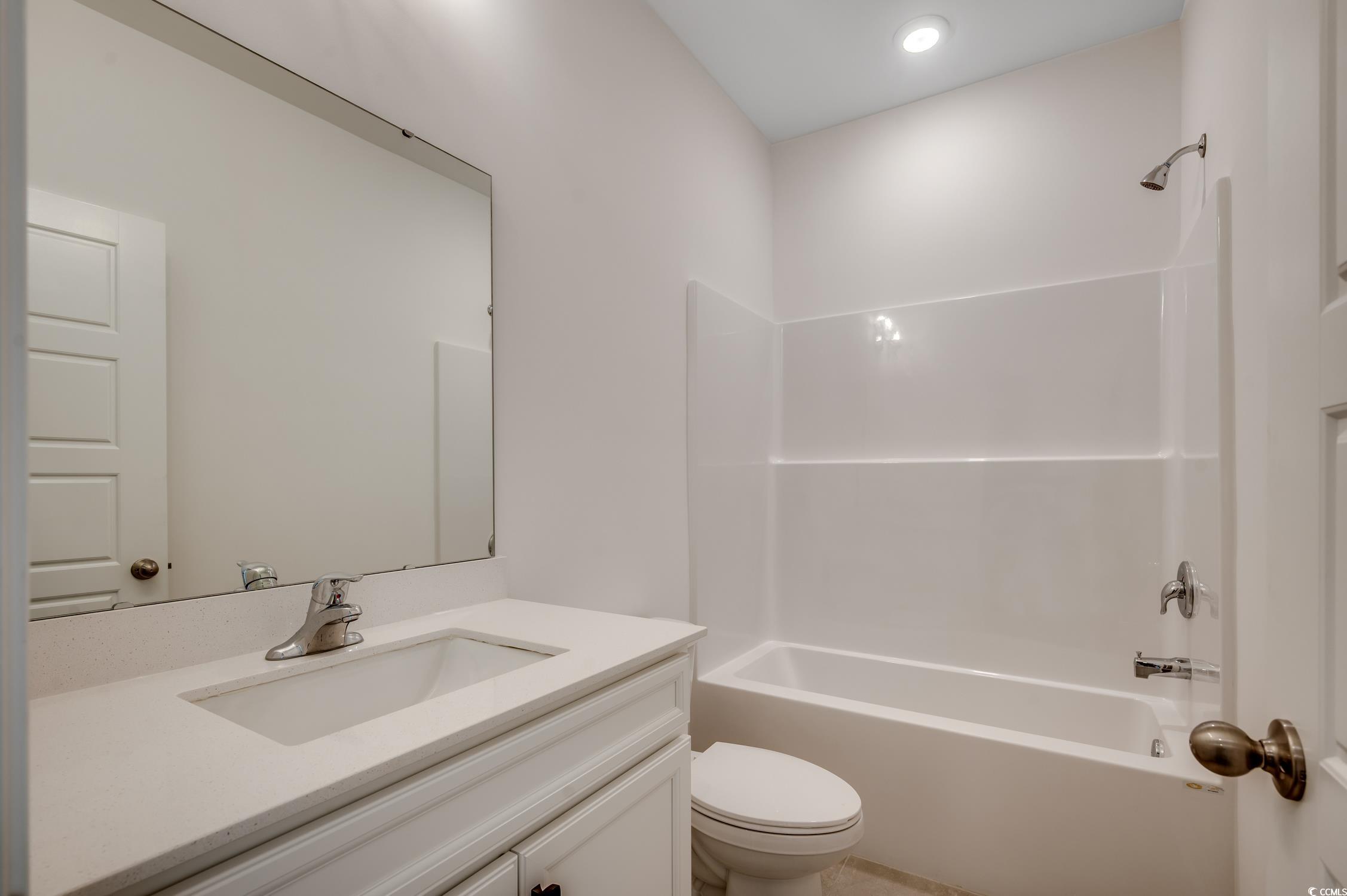 4004 Braid Court Myrtle Beach, SC 29588 - Photo 15 of 24 Bathroom with vanity and washtub / shower combination
