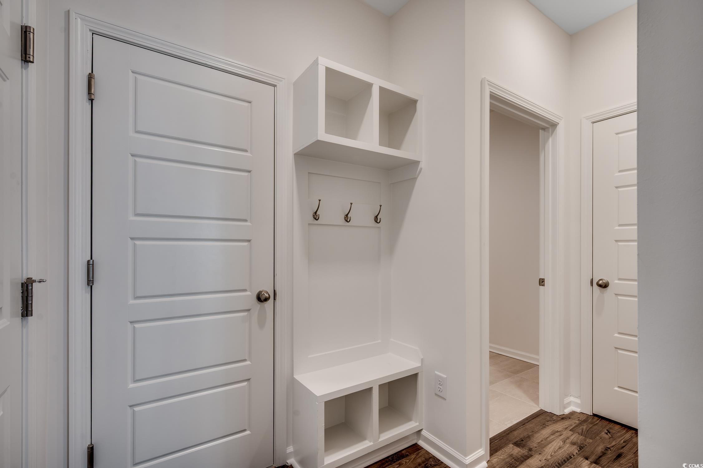 4004 Braid Court Myrtle Beach, SC 29588 - Photo 16 of 24 Mudroom with dark wood finished floors and baseboards