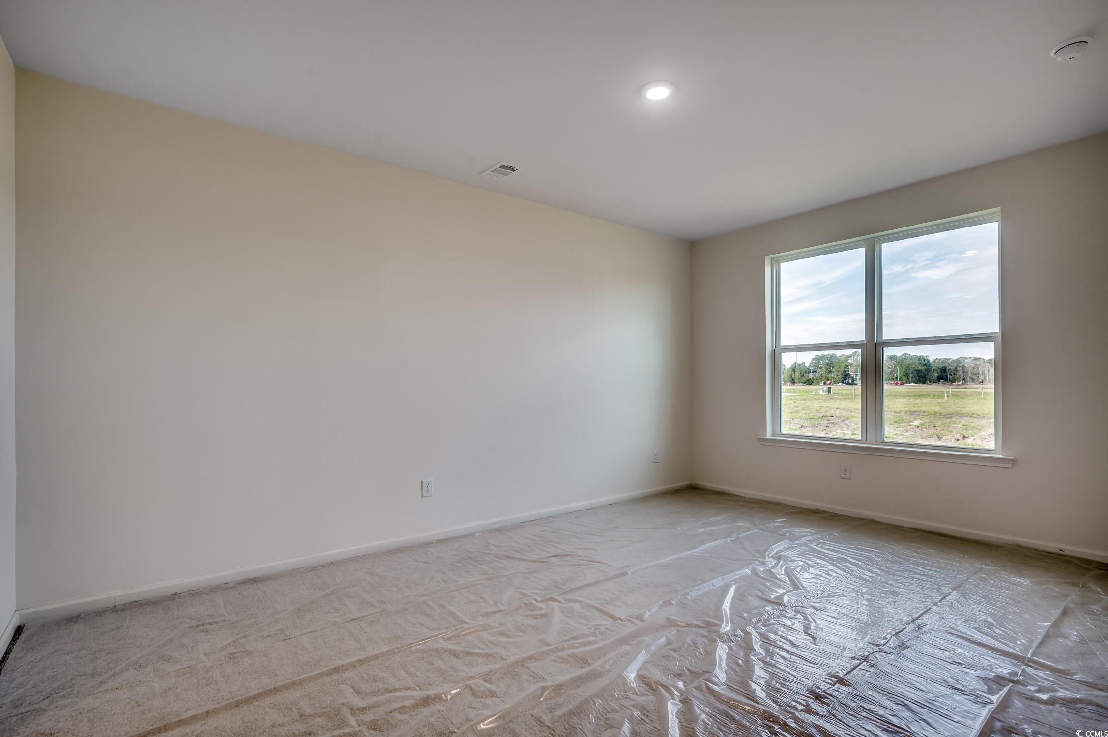 4004 Braid Court Myrtle Beach, SC 29588 - Photo 9 of 24 Empty room featuring baseboards