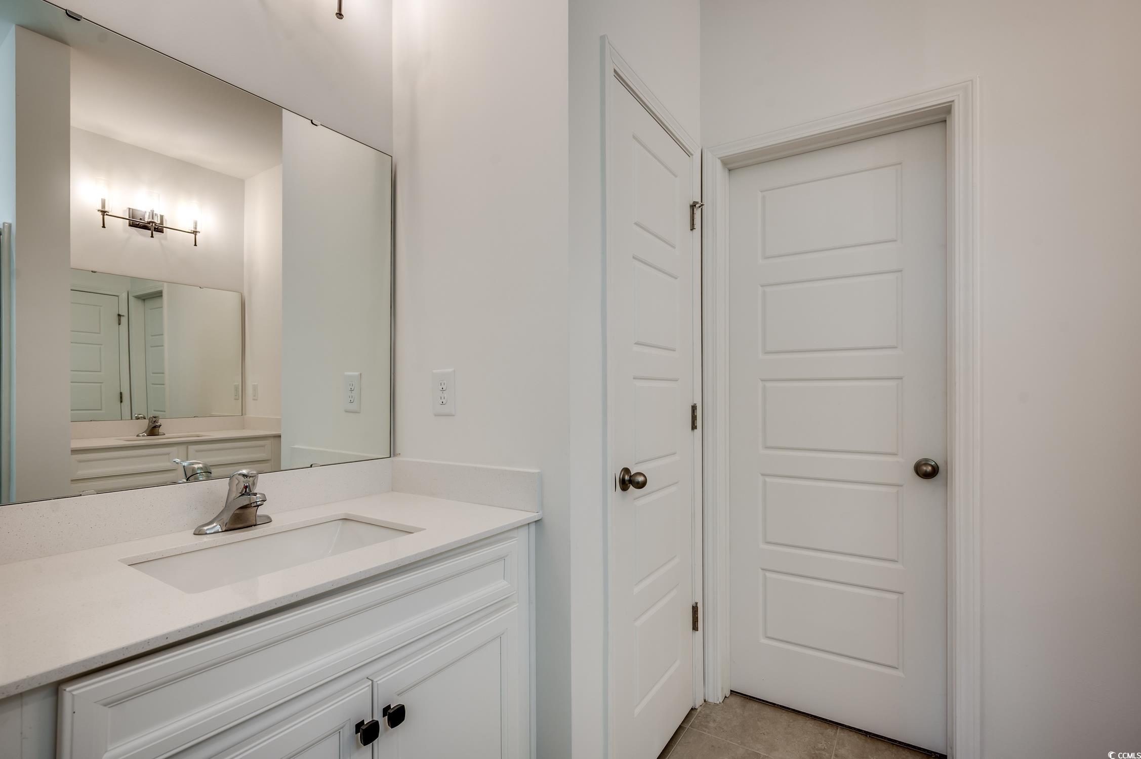 4004 Braid Court Myrtle Beach, SC 29588 - Photo 10 of 24 Bathroom featuring vanity and light tile patterned floors