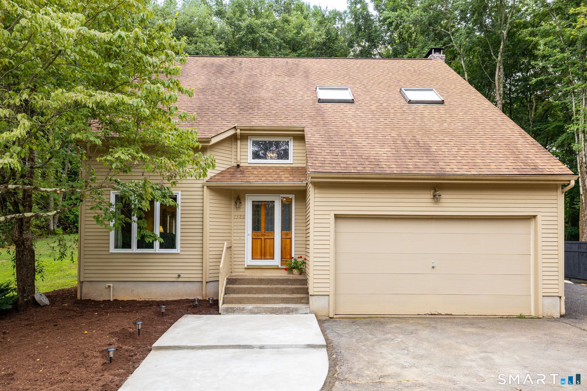 1386 Cedar Swamp Road Coventry, CT 06238 - Photo 3 of 39 Enter through the front door or directly from the oversized two-car garage.