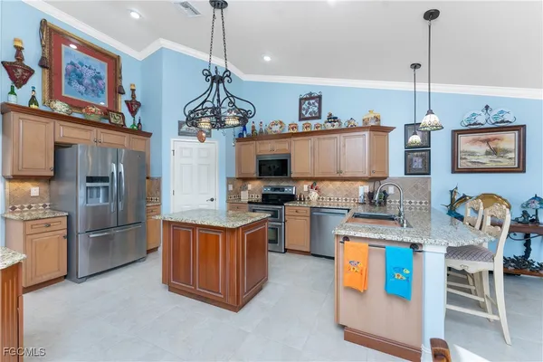 a kitchen that has a lot of cabinets in it