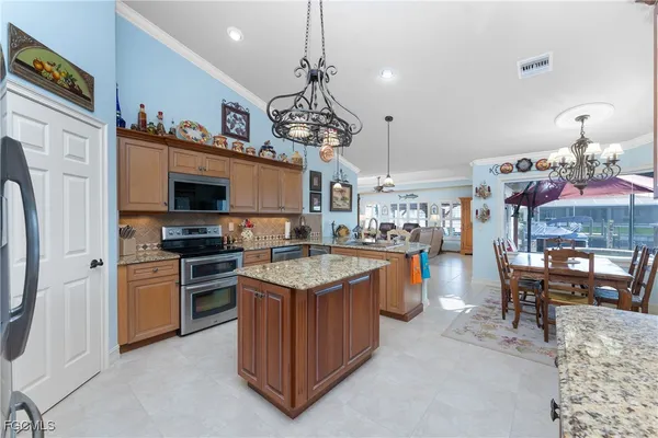 a kitchen with a table and chairs in it