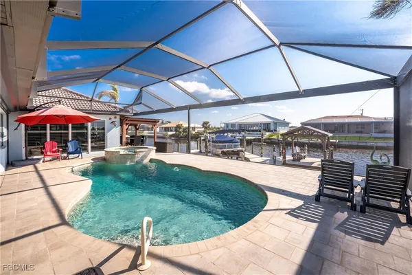 a view of a backyard with sitting area