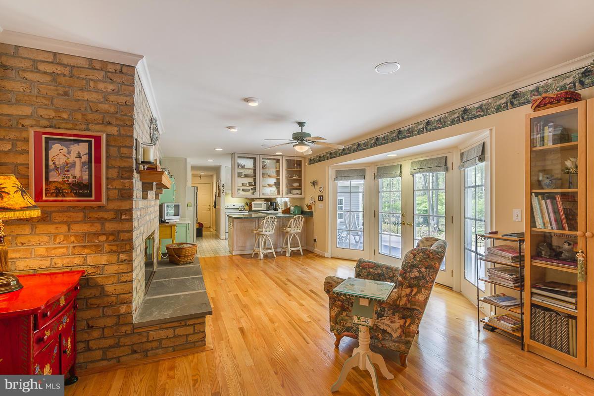 8190 Orchard Point Road Pasadena, MD 21122 - Photo 14 of 29 Family Room - fireplace is two sided