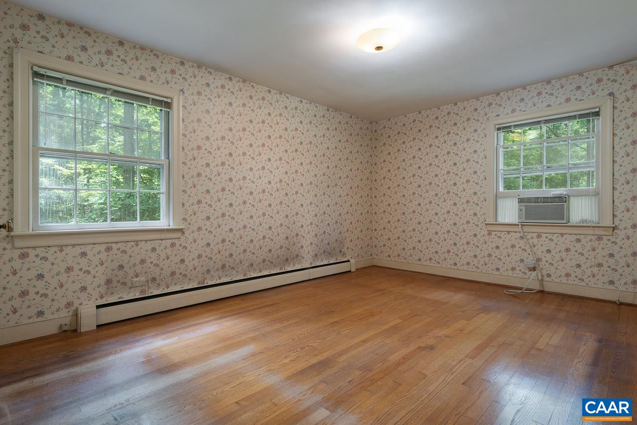 995 Shadwell Road Keswick, VA 22947 - Photo 11 of 23 an empty room with wooden floor and windows