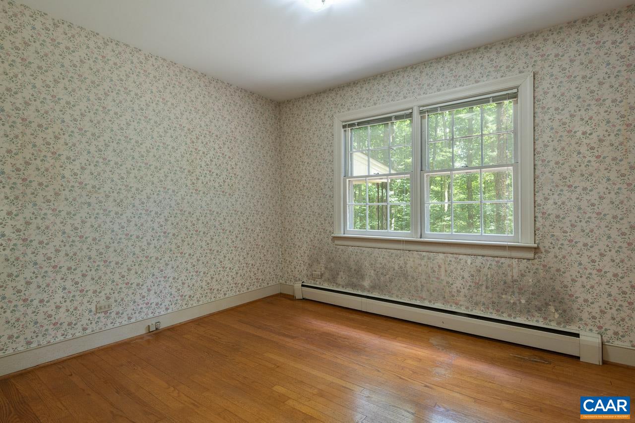 995 Shadwell Road Keswick, VA 22947 - Photo 13 of 23 an empty room with wooden floor and windows